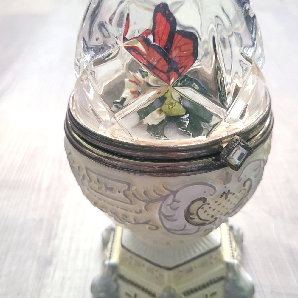 Butterfly crystal and porcelain egg shaped music box.